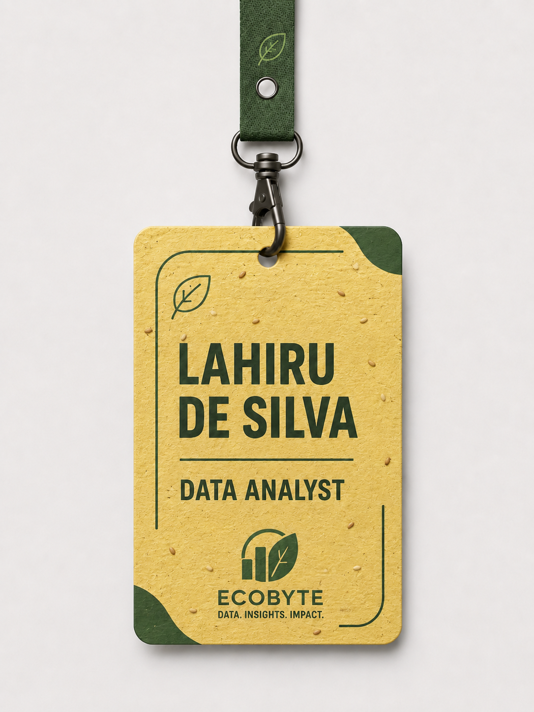 A seed-paper name tag, flecked with real seeds, on a green lanyard